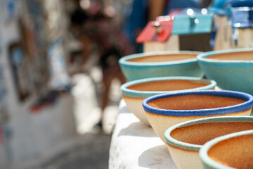 Gifts of colors typical of Santorini in Greece, bells, cats, and pendants