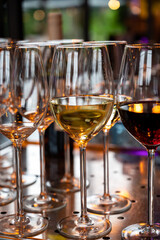 Many glasses of white and red white served for party or celebration