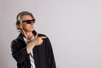 Fototapeta premium An adult man points his finger in the direction of