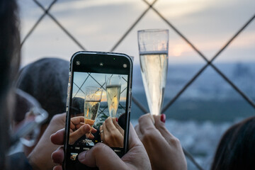 person photographing champagne on Eiffel tower © Tom