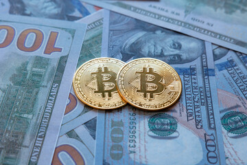 Bitcoin background concept photo. Two bitcoins on the US dollars.