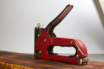 construction stapler with staples on the board
