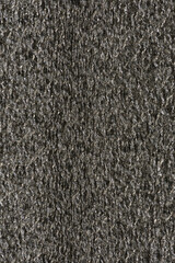 Gray black macro metallic packing material texture background
