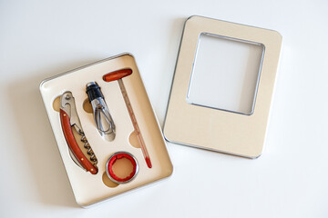 Corkscrew, wine thermometer and other wine accessories in a box