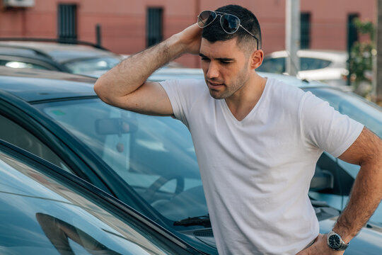 Man Buying Used Or Second-hand Car At Dealership