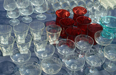 collection of rare very fragile vintage style glass glasses and wine goblets for sale in flea market