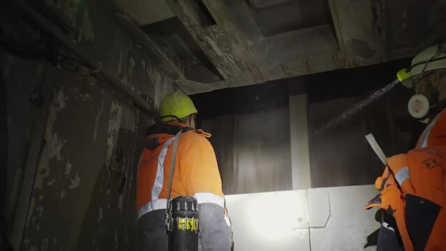 The miners go down the elevator into the mine. Underground development, underground mining, underground mining.