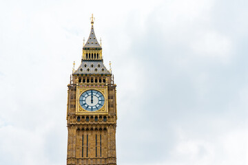 Fototapeta na wymiar Big Ben, London, UK. A view of the popular London landmark, the clock tower known as Big Ben against a blue and cloudy sky. High quality photo
