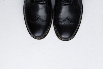 black shoes on white background, flatlay. Preparation for wedding