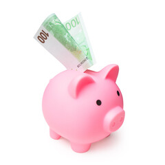 A pink piggy bank with one hundred euro bills sticking out of it. Isolated with clipping path....