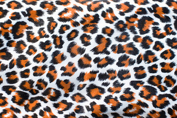 On the fabric print the skin of a wild animal leopard, cheetah, hyena, close up. Popular fabric for...