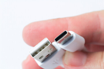 Hand holding USB-C type cable connector