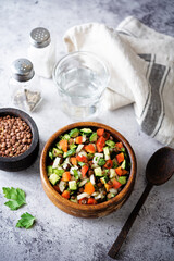 Lentil red bell pepper cucumber salad in a bowl
