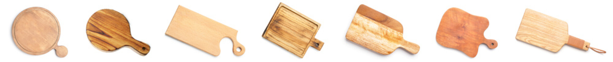 Set of different wooden boards on white background, top view