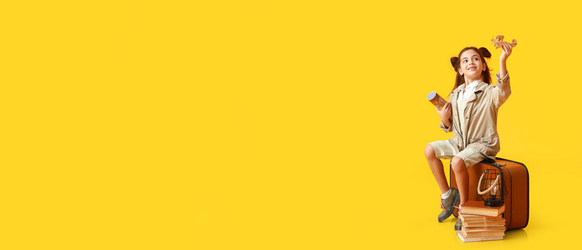 Cute little adventurer on yellow background with space for text