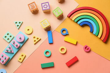 Children building blocks on color background