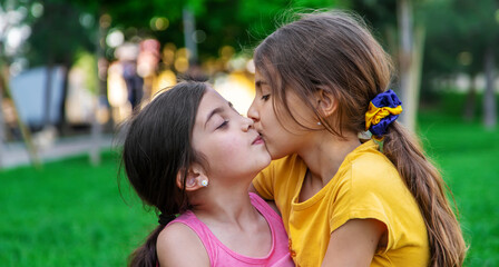 girlfriends children hugging in the park.selective focus.