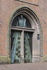 Entrance door to 98-meter high Onze Lieve Vrouwetoren (Our Lady tower, 15th century) or Langejan (Long John), the third-tallest church tower in the Netherlands. Amersfoort. the Netherlands.