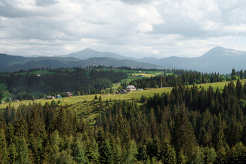 Bright hilly area around the farm. Picturesque day and great scene. Location Carpathians, Ukraine, Europe. Ecology protection concept. Discover the beauty of the world.