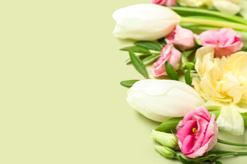 Fototapeta premium Beautiful flowers with leaves on green background, closeup
