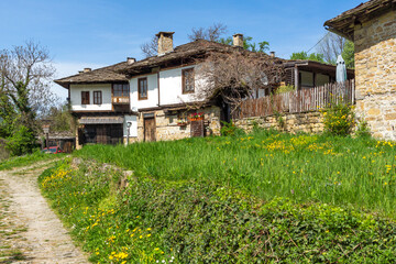 Fototapeta na wymiar Typical street and old houses at village of Bozhentsi, Bulgaria