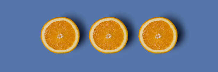Banner three cut oranges in a row