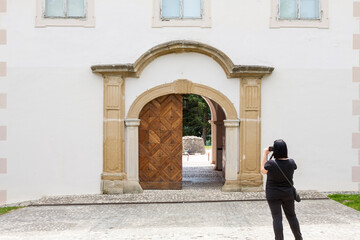 Tourist photographer taking pictures with camera of museum of Matije Gupca, Croatia