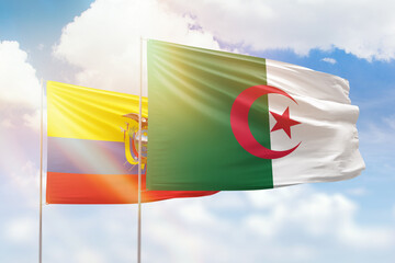 Sunny blue sky and flags of algeria and ecuador