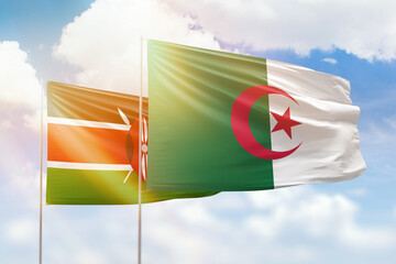 Sunny blue sky and flags of algeria and kenya