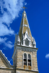 Nice steeple of a church under a blue sky in Quebec, Canada
