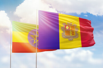 Sunny blue sky and flags of algeria and ethiopia