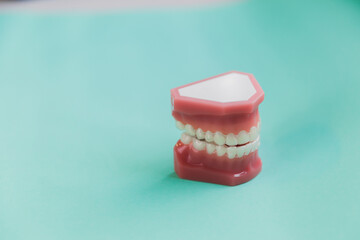 3d render of invisalign removable and invisible retainer over blue green  background