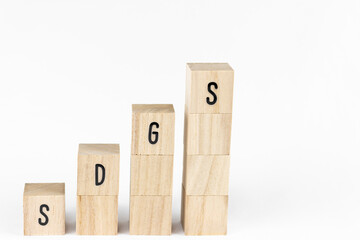 積み上げた木製ブロックのSDGs。SDGsのイメージ