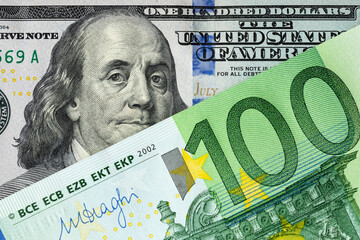 One hundred US dollars and 100 euro banknote. Diagonal arrangement. Currency exchange, currency transactions, international trade concept