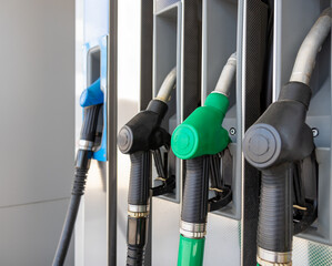 Fuel nozzles close-up on gas station.