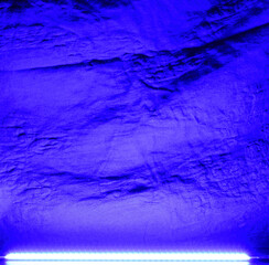 Abstract neon blue background created by a LED strip.