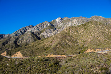 Rock-Covered Mountains Created by Fault Lines Stand Tall Behind the Angeles Crest Highway in Los Angeles, California, USA