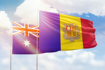 Sunny blue sky and flags of algeria and australia