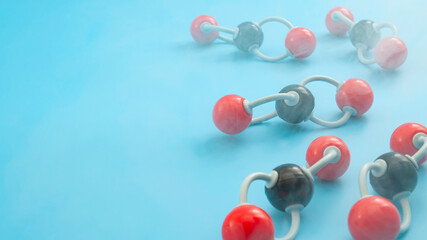 Greenhouse gas pollution, climate change and molecular structure of carbon dioxide concept with CO2 and smoke molecules isolated on blue background with copy space