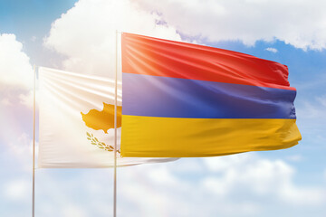 Sunny blue sky and flags of armenia and cyprus