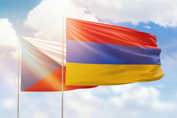 Sunny blue sky and flags of armenia and czechia