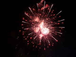 Fototapeta premium Fireworks display in the port town. low light