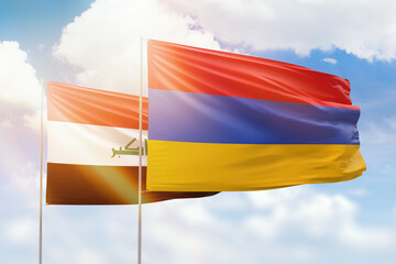 Sunny blue sky and flags of armenia and iraq