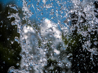 drops water of the fountain in the air. blure background