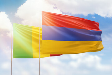 Sunny blue sky and flags of armenia and mali