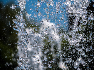 drops water of the fountain in the air. blure background
