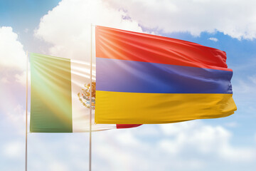 Sunny blue sky and flags of armenia and mexico