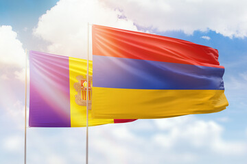 Sunny blue sky and flags of armenia and andorra