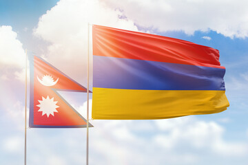 Sunny blue sky and flags of armenia and nepal