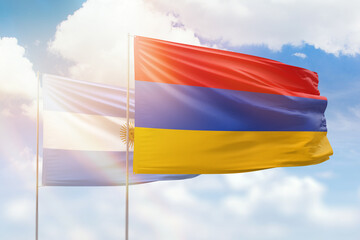 Sunny blue sky and flags of armenia and argentina